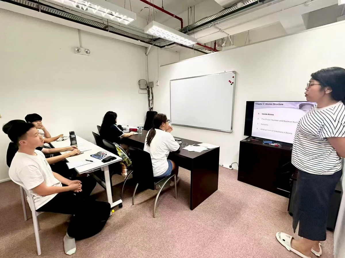 Ms Chan teaching students